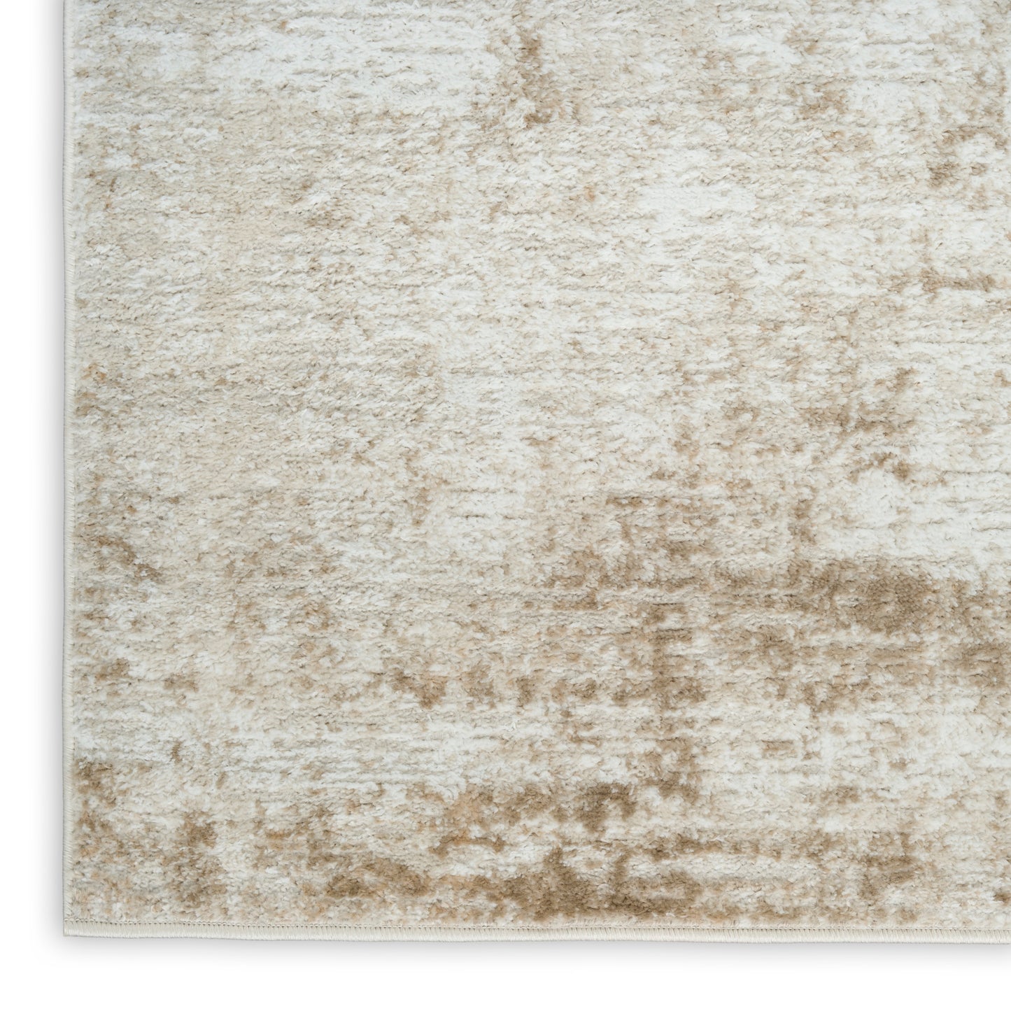 Beige cream distressed rug with plush pile and subtle marbled taupe pattern; rectangular with light binding edge.