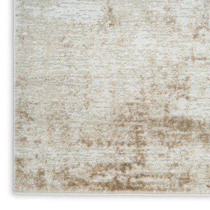 Beige cream distressed rug with plush pile and subtle marbled taupe pattern; rectangular with light binding edge.