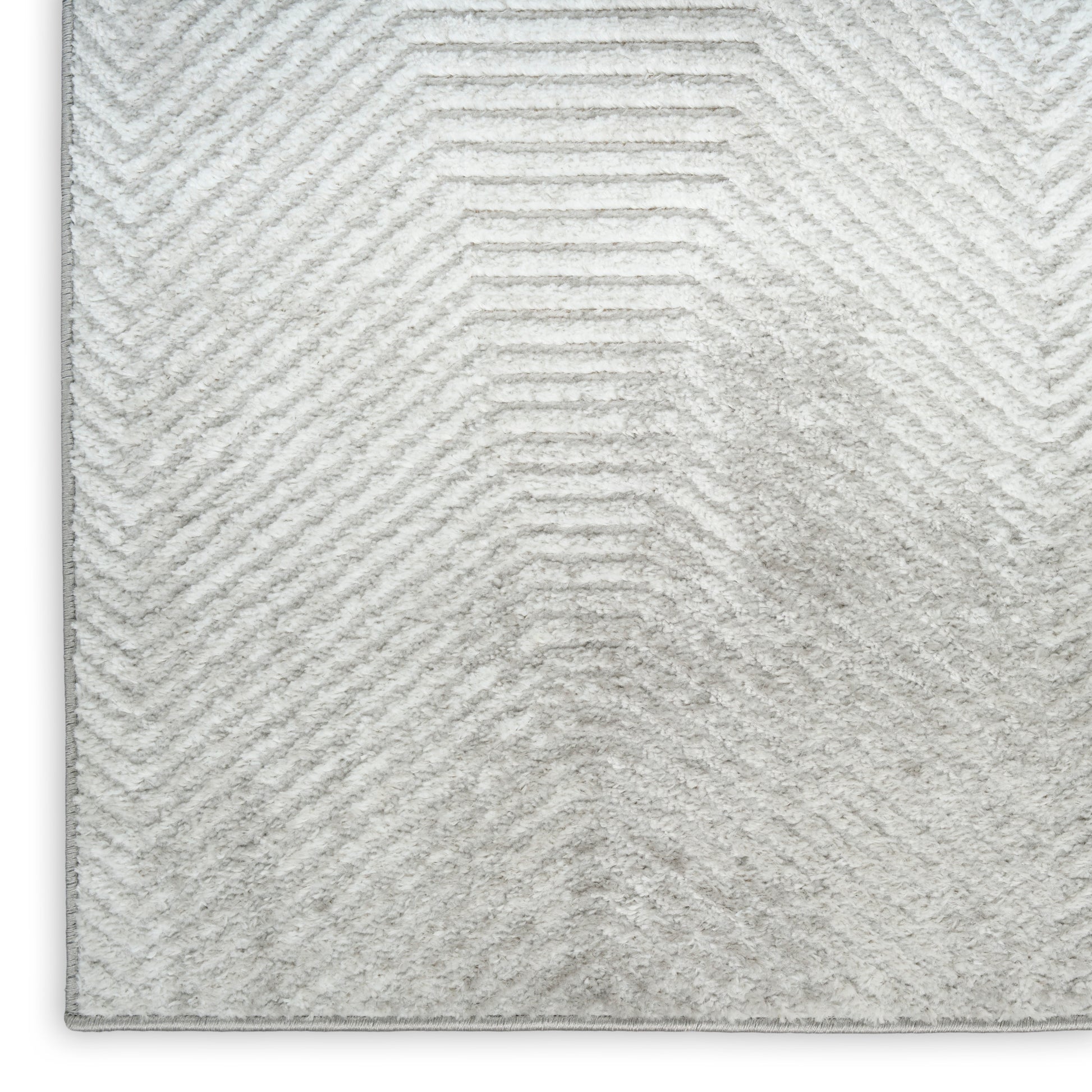 Light gray shag rug with a subtle chevron pattern and plush pile, vintage rectangular area rug.