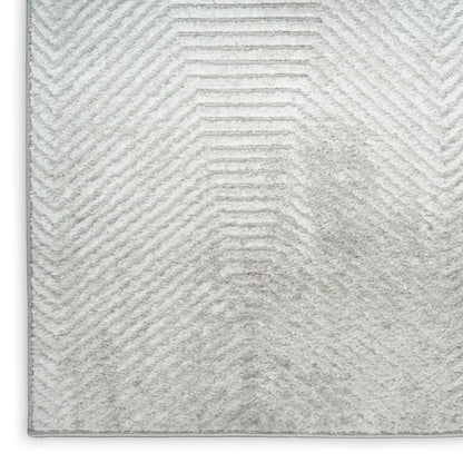 Light gray shag rug with a subtle chevron pattern and plush pile, vintage rectangular area rug.