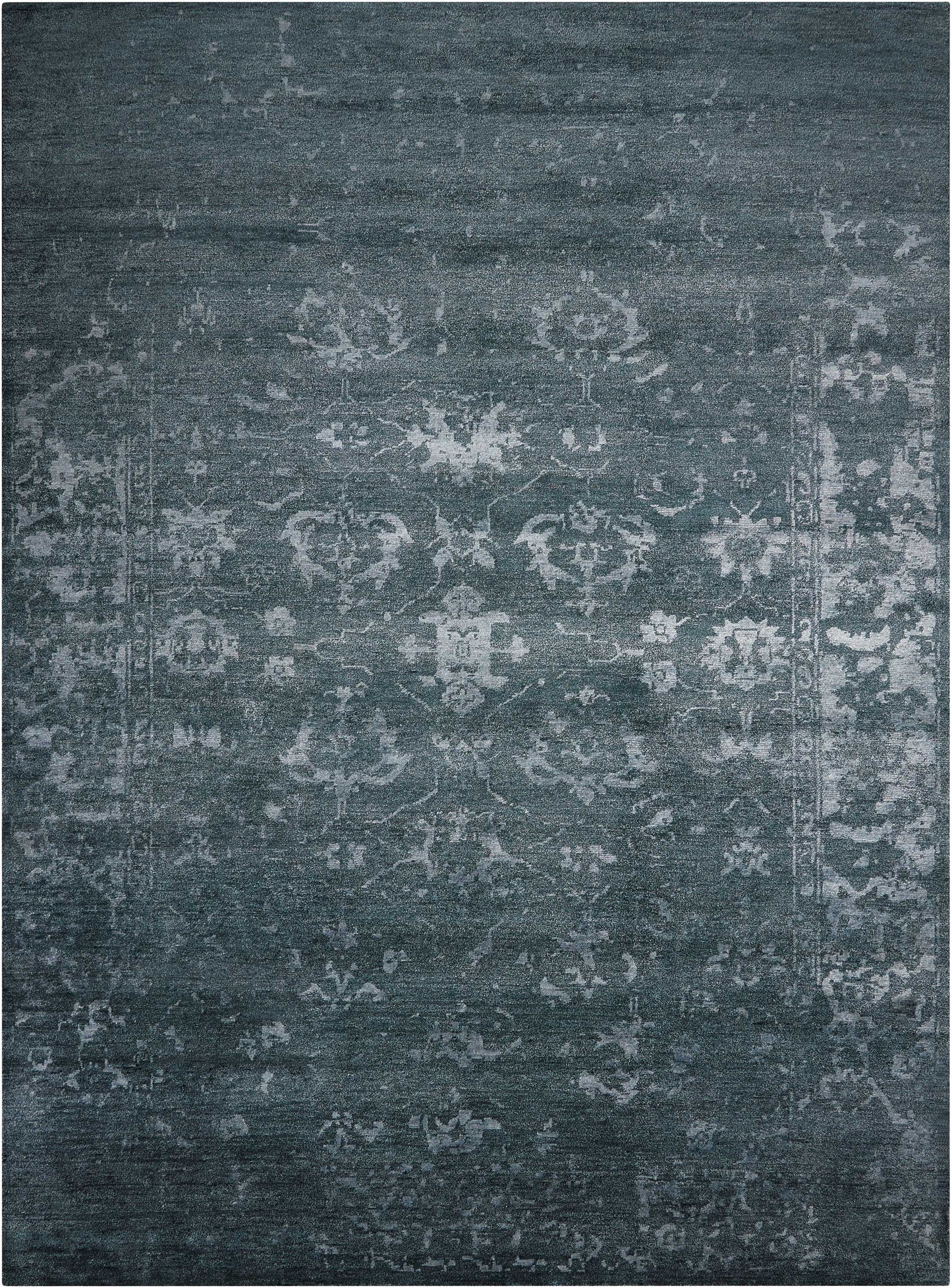 Blue-gray distressed oriental rug with faded Persian medallion pattern, vintage-style living room area rug.