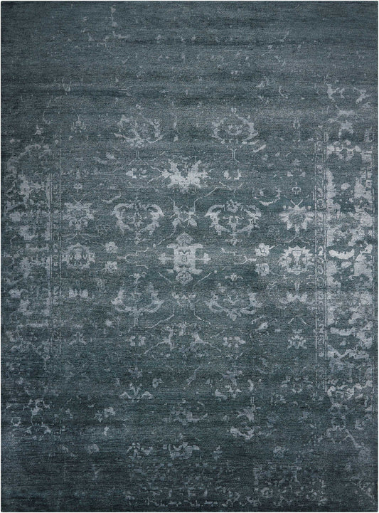 Blue-gray distressed oriental rug with faded Persian medallion pattern, vintage-style living room area rug.