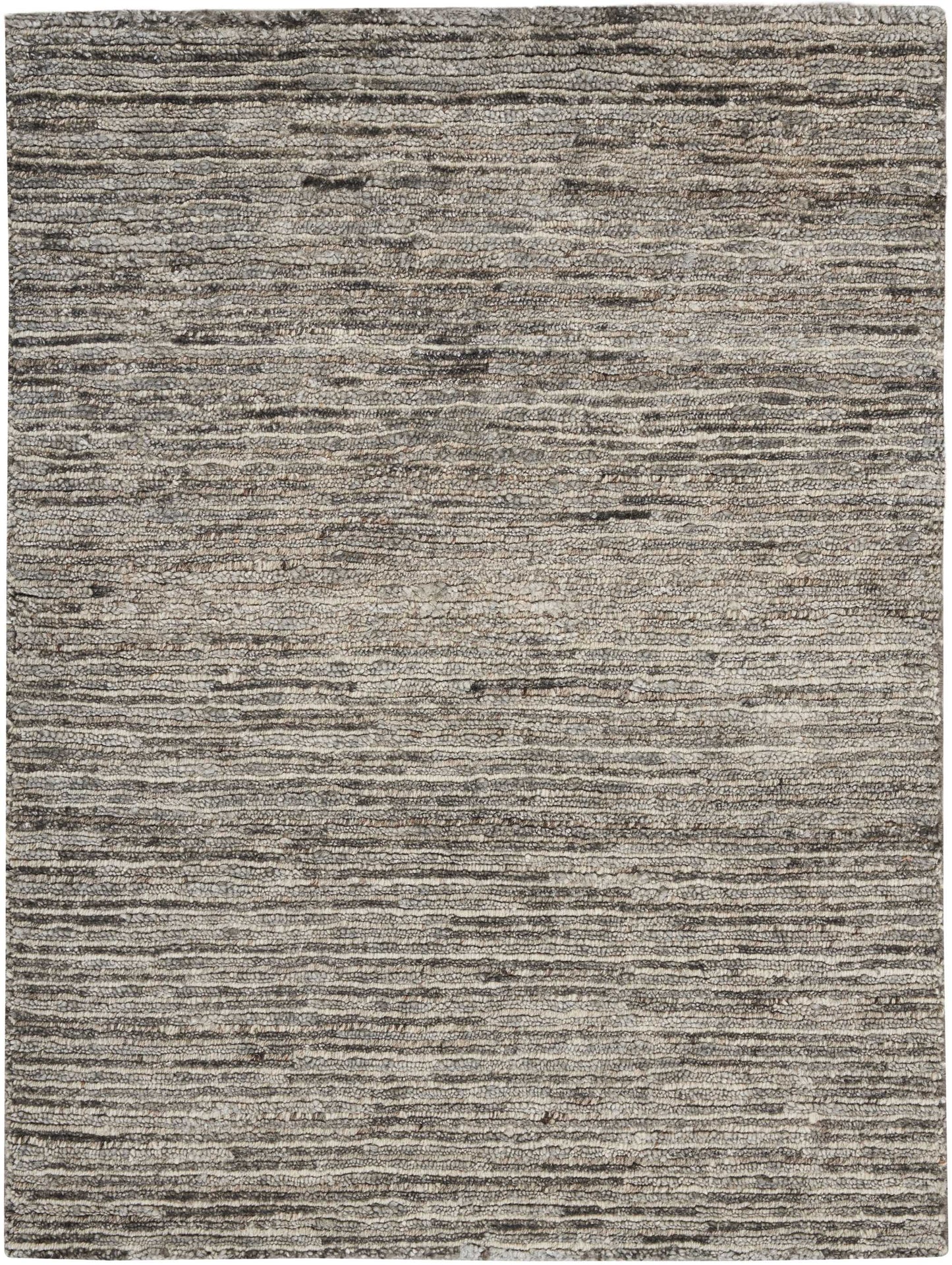 Grey, taupe and beige striped area rug with textured, layered lines and low pile.