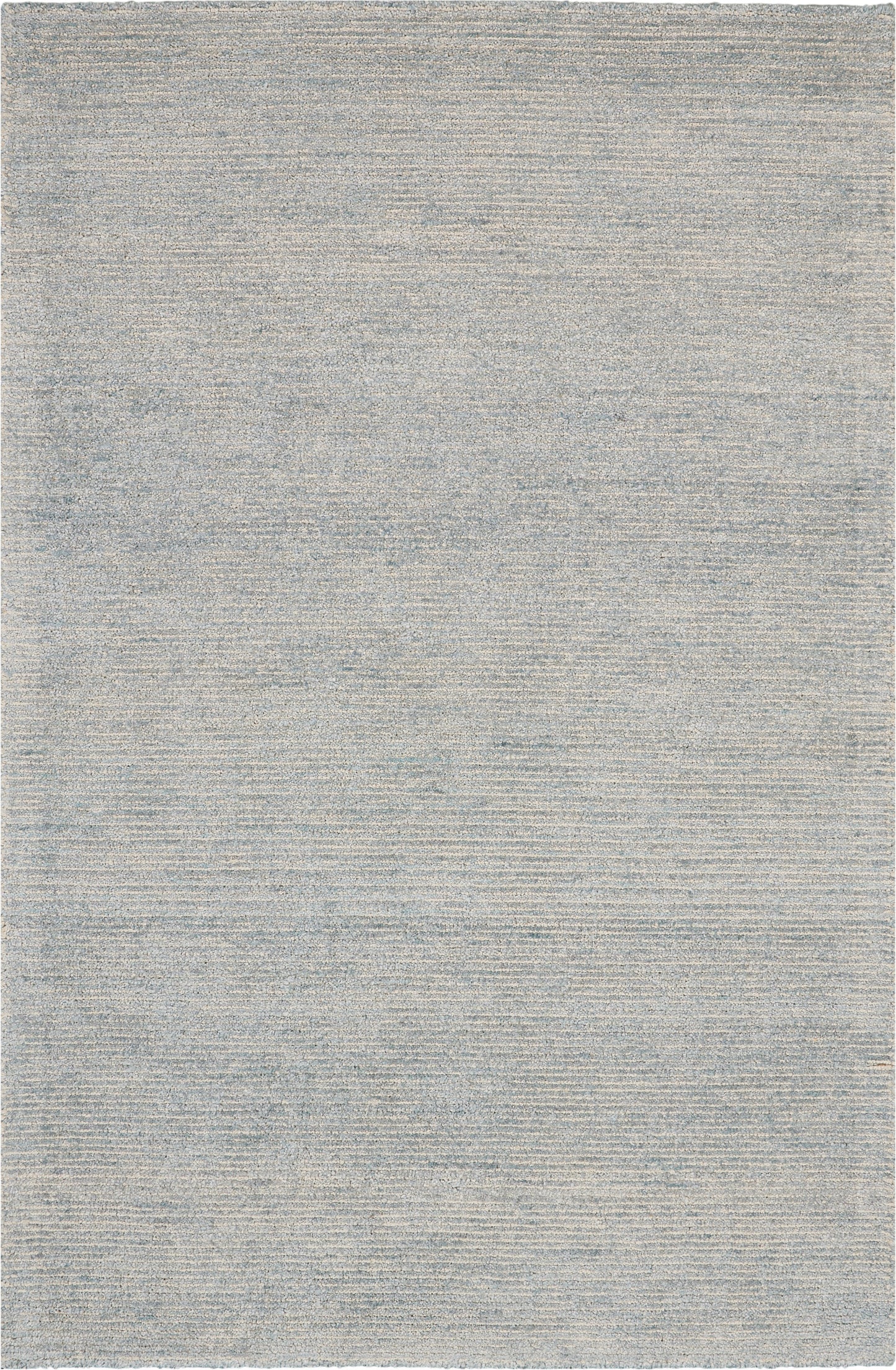 Light gray flatweave rug with subtle tonal texture; minimalist decor for living room or bedroom.