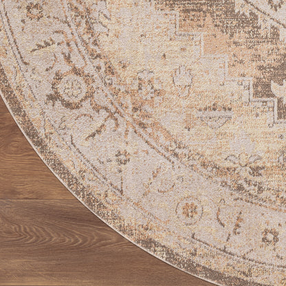 Round beige rug with intricate oriental floral pattern on wooden floor; curved edge visible.