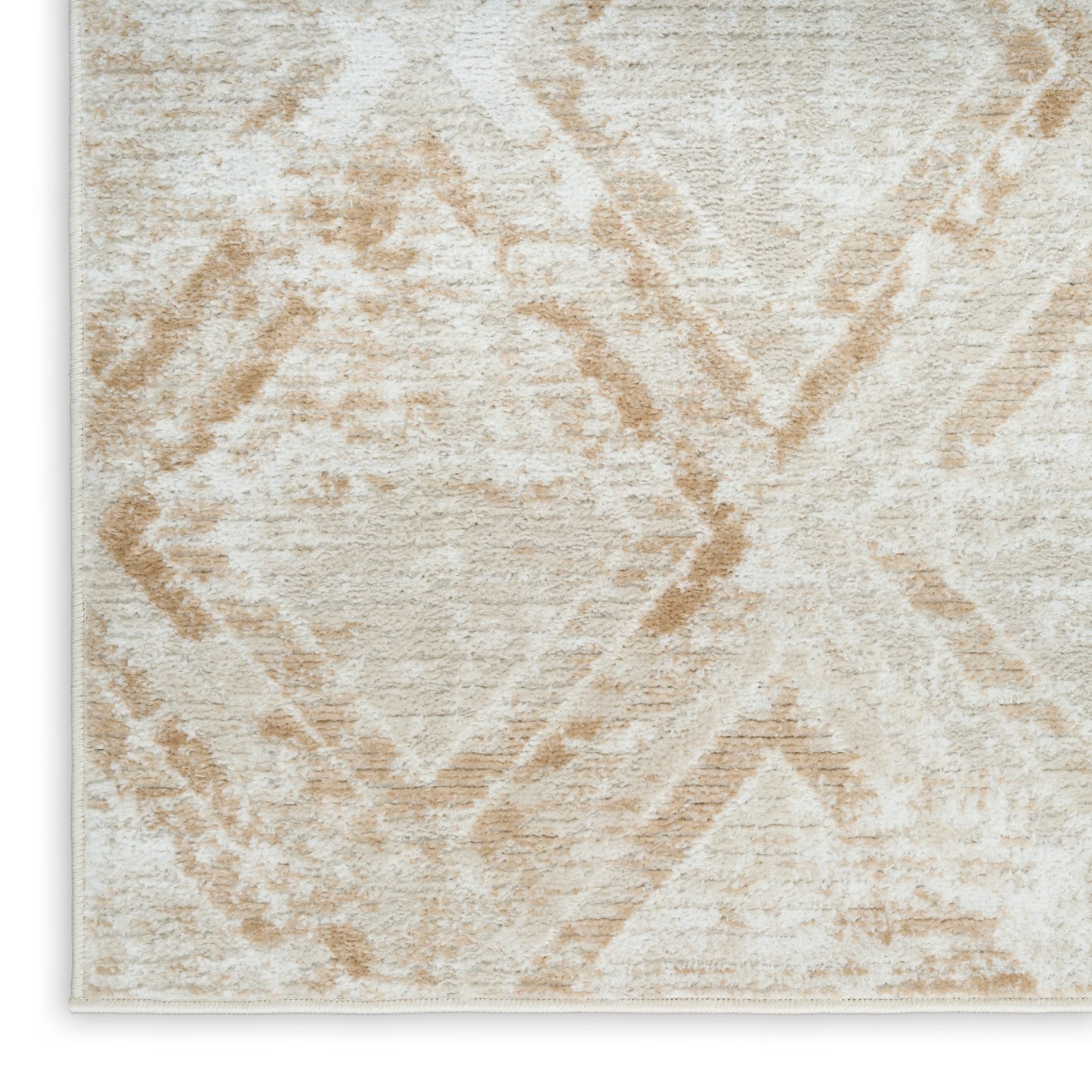 Beige area rug with cream background & light tan diamond geometric pattern, plush texture.