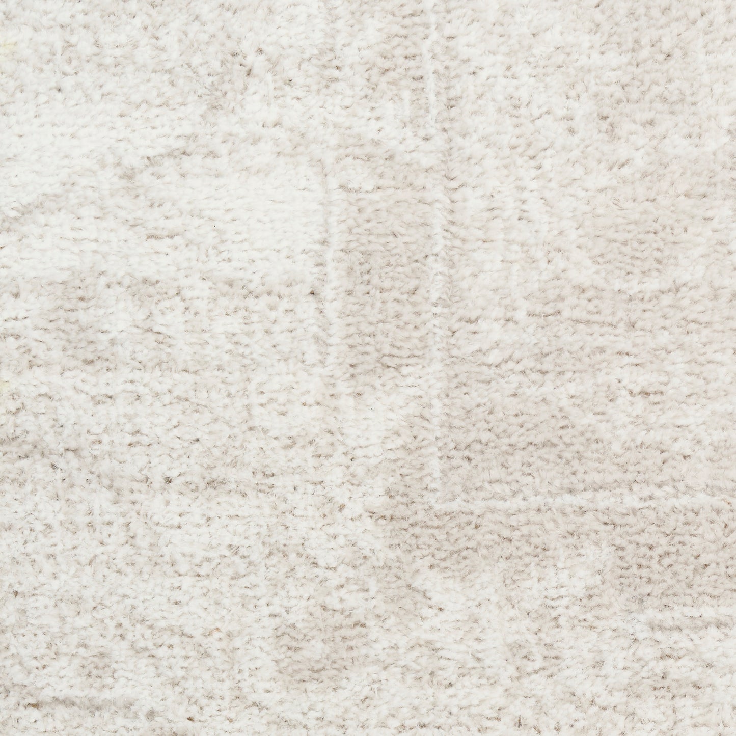 Cream shag rug with plush, textured beige pile for a soft, cozy living room look.