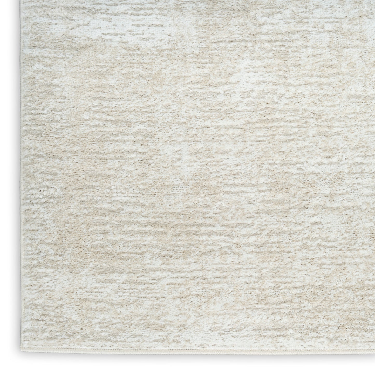 Cream shag rug with plush texture and beige fibers; rectangular area rug for living spaces.