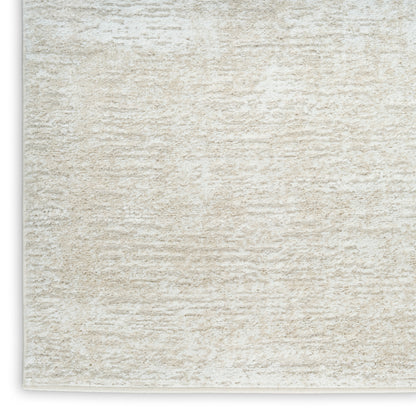 Cream shag rug with plush texture and beige fibers; rectangular area rug for living spaces.