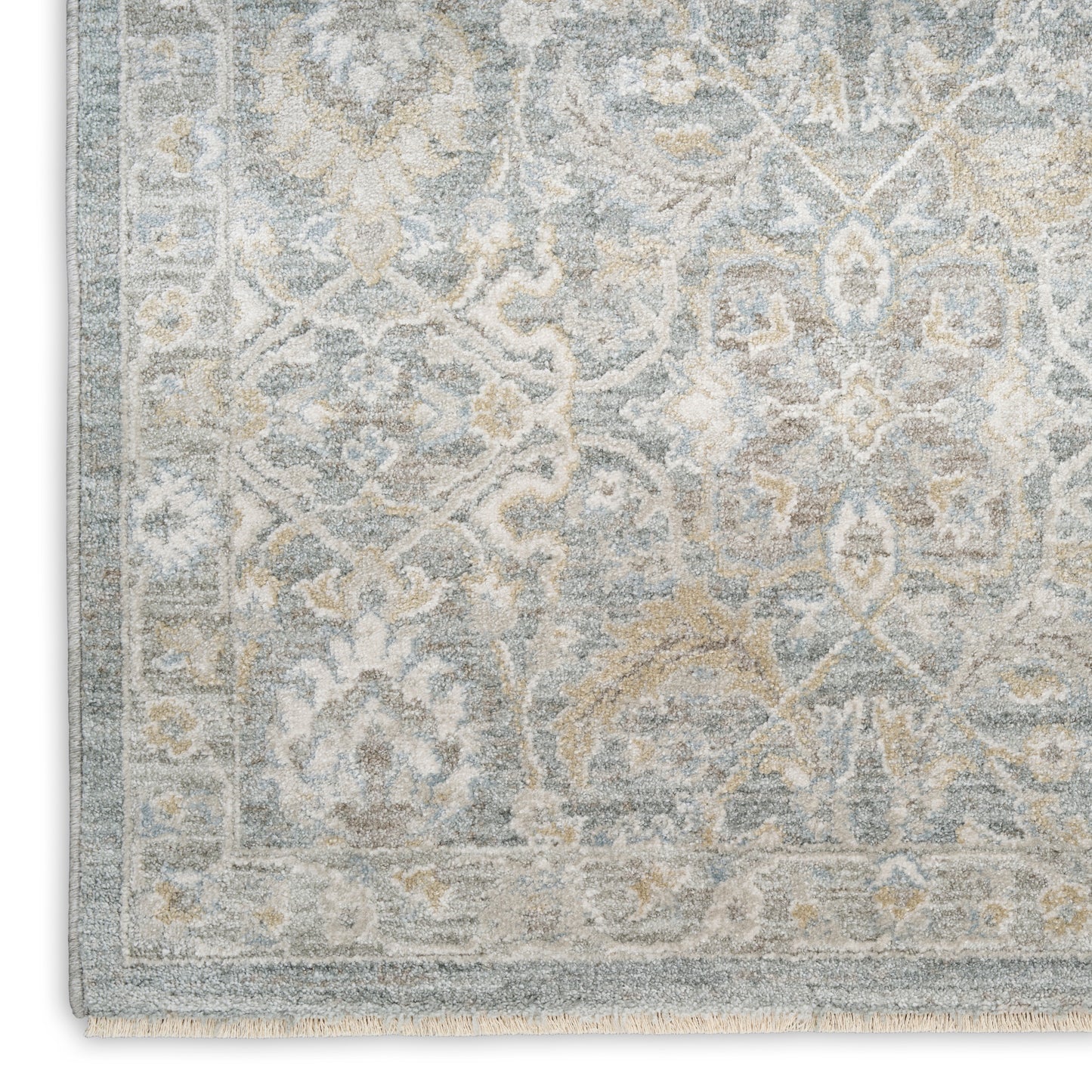 Soft blue and ivory distressed oriental rug with floral motifs and light border; fringed edges, ideal for living rooms.