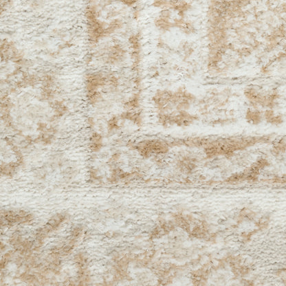 Cream-tan shag rug close-up with plush pile and subtle rectangular pattern.
