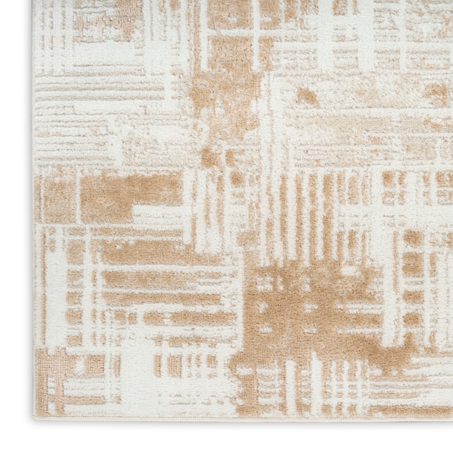 Abstract beige and ivory area rug with a geometric block pattern and soft, textured surface.