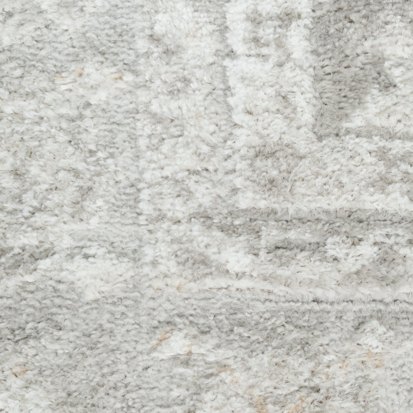 Soft light gray shag rug with cream flecks and a plush, textured surface for modern living spaces.