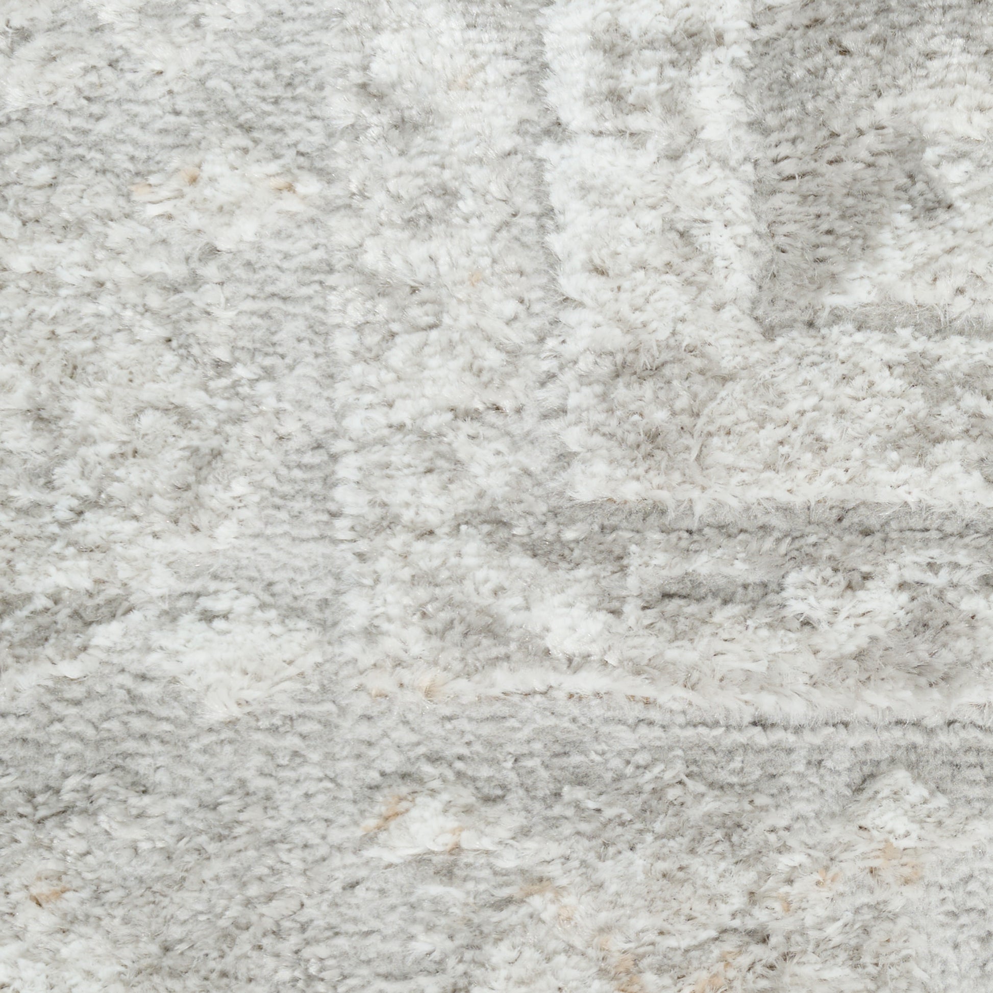 Soft light gray shag rug with cream flecks and a plush, textured surface for modern living spaces.
