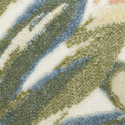 Close-up of a plush rug with cream base and olive green and blue diagonal stripes.