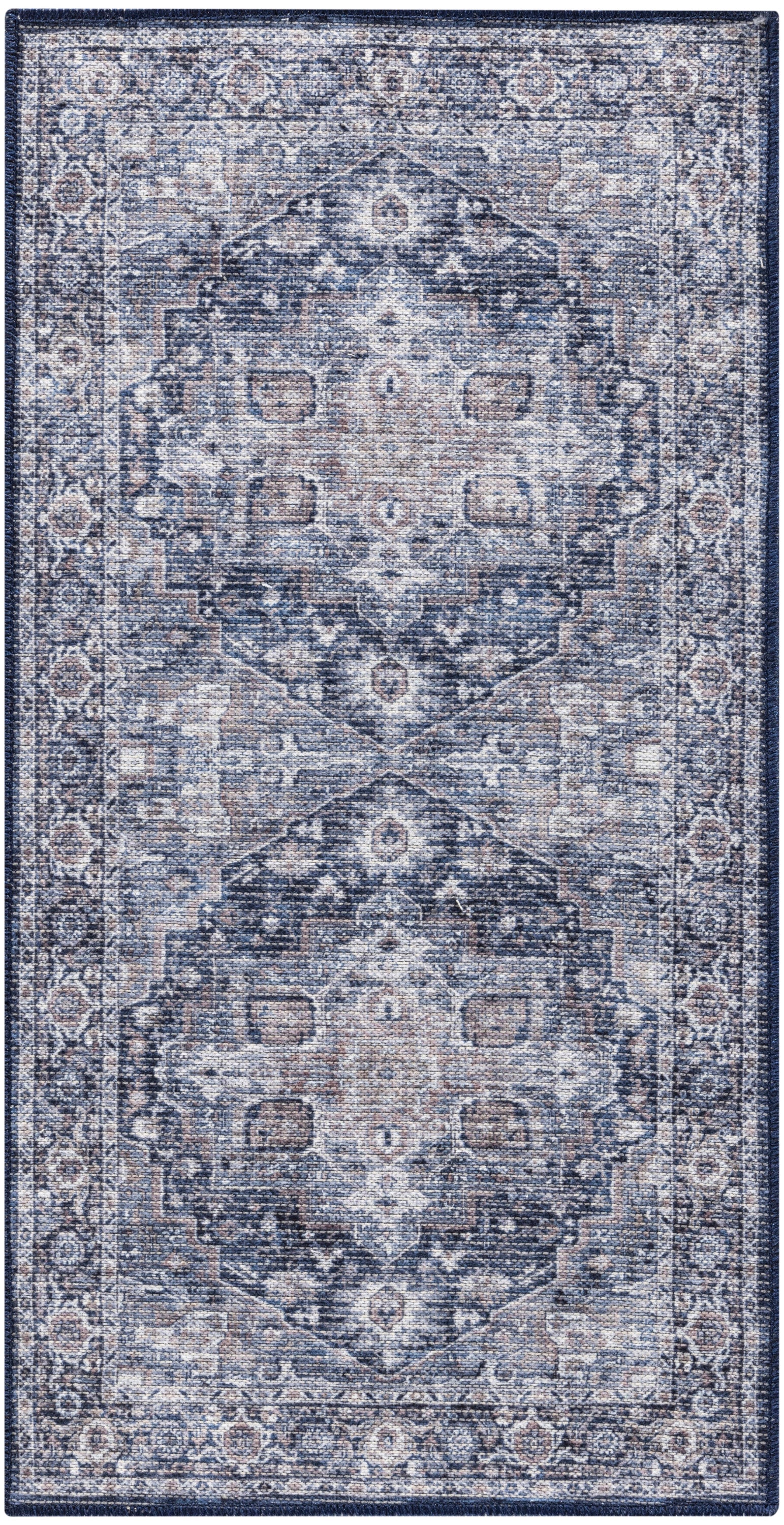 Rectangular blue distressed oriental rug with ivory and beige central medallion and ornate border.