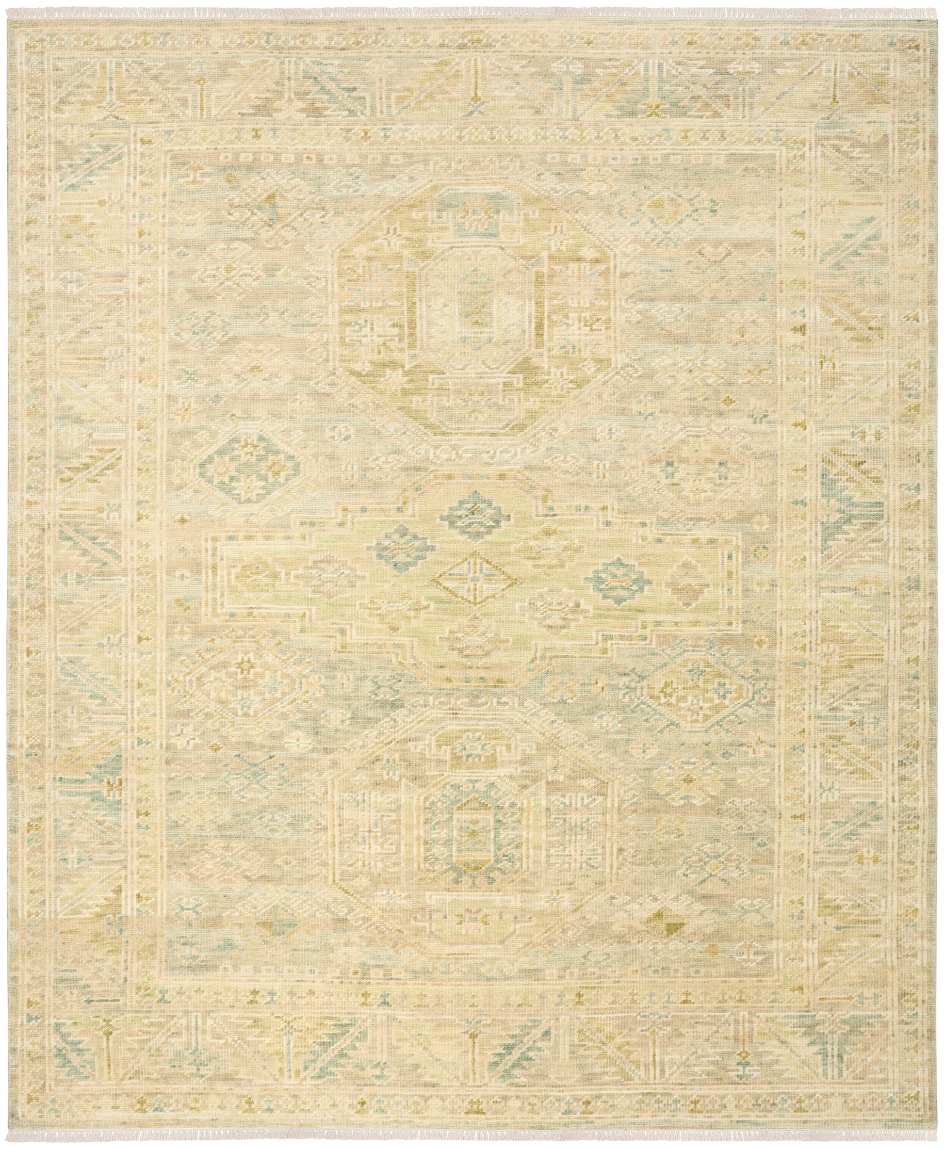 Soft vintage-inspired rug in cream, beige and pale blue with geometric medallions and an intricate border.