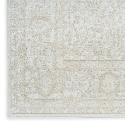 Cream beige oriental-pattern area rug with ivory motifs and light border, plush texture.