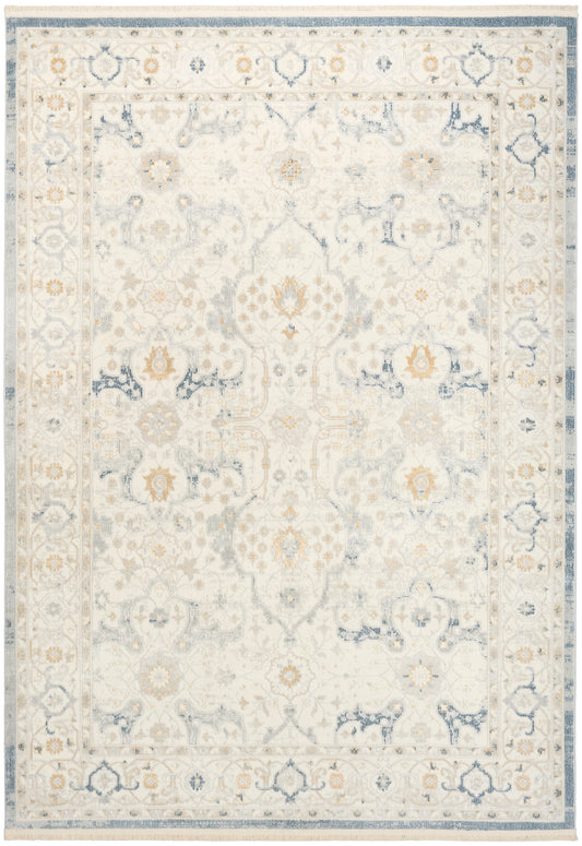 Cream and blue ornate area rug with distressed vintage feel, floral medallion motif and decorative border.