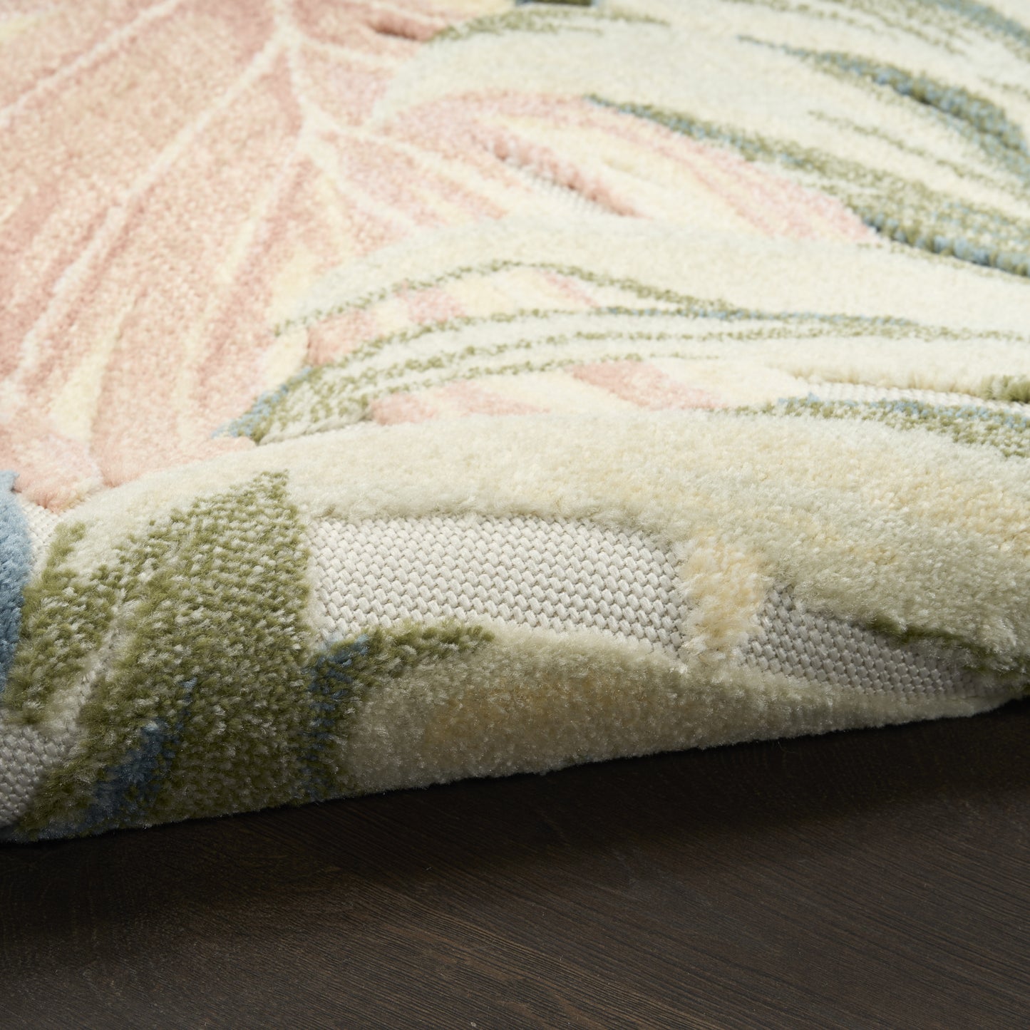 Pastel shag area rug with pink, cream, mint and blue patterns; thick plush pile and visible backing.