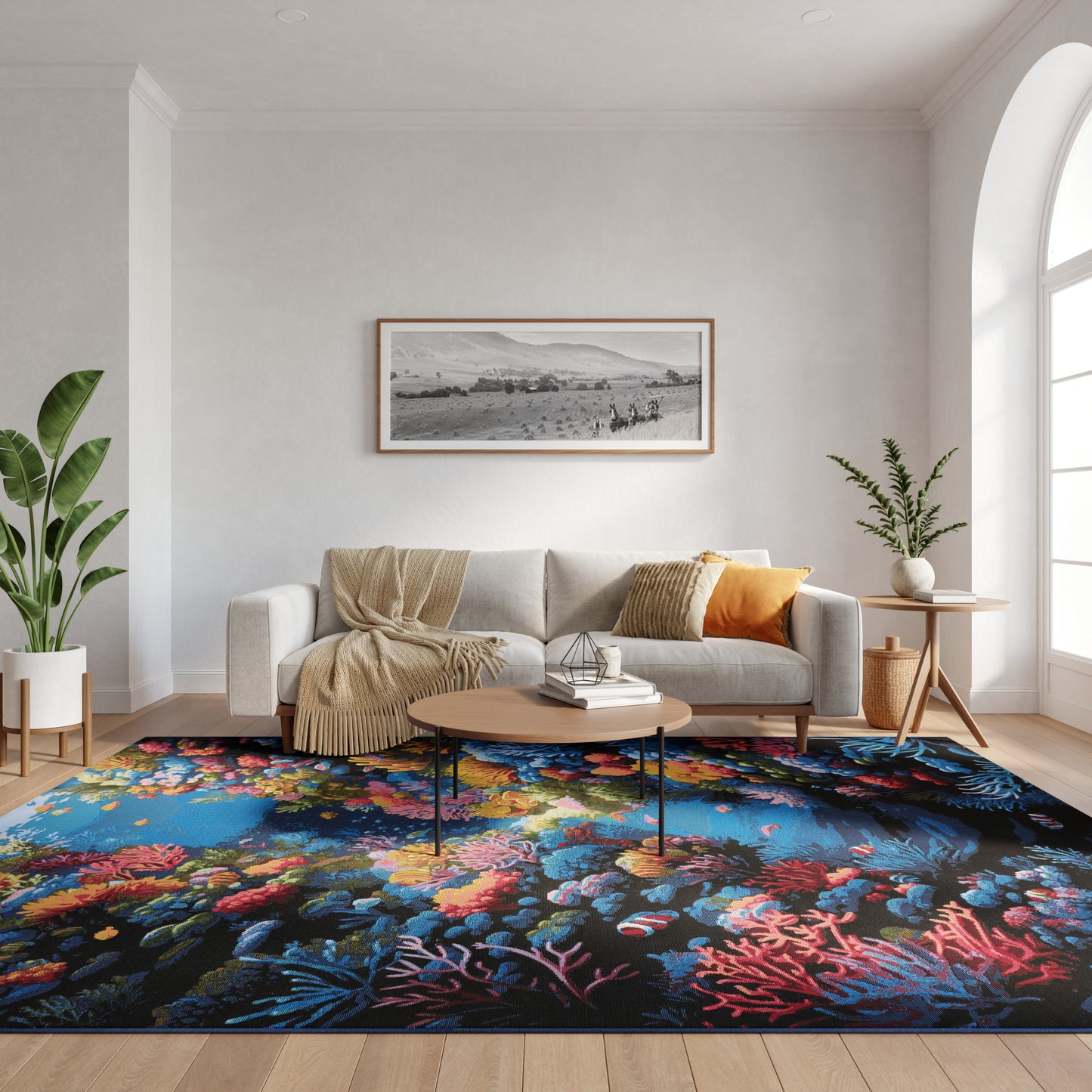 Modern living room with a bold multicolored coral reef rug under a round wooden coffee table, gray sofa, beige throw and green plants.