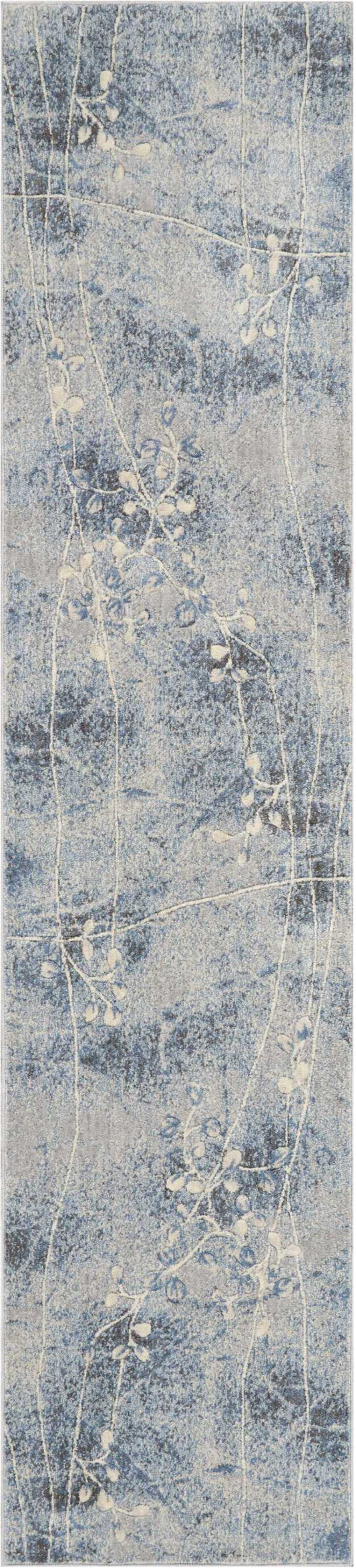 Blue-gray rectangular runner rug with white botanical vine pattern and a distressed texture.