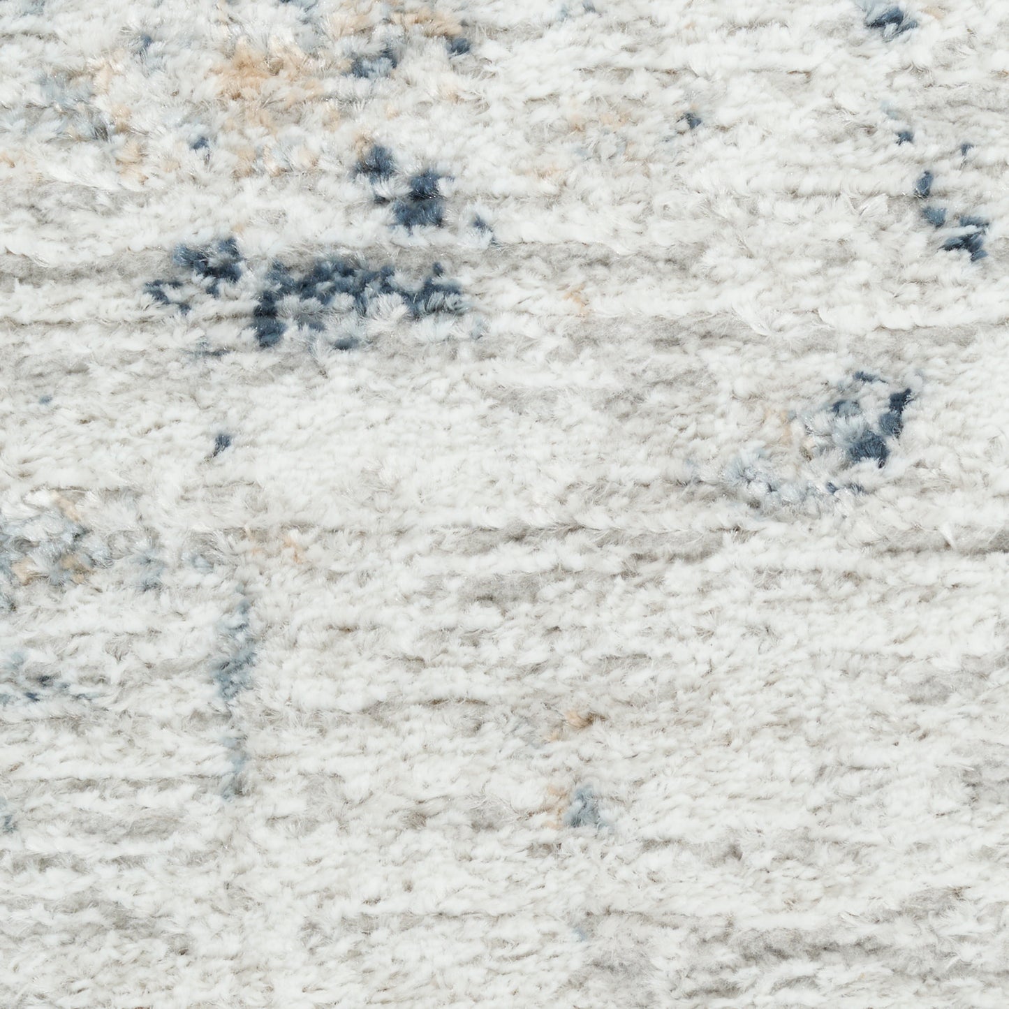 Cream shag rug with blue-gray accents and plush, fluffy pile.