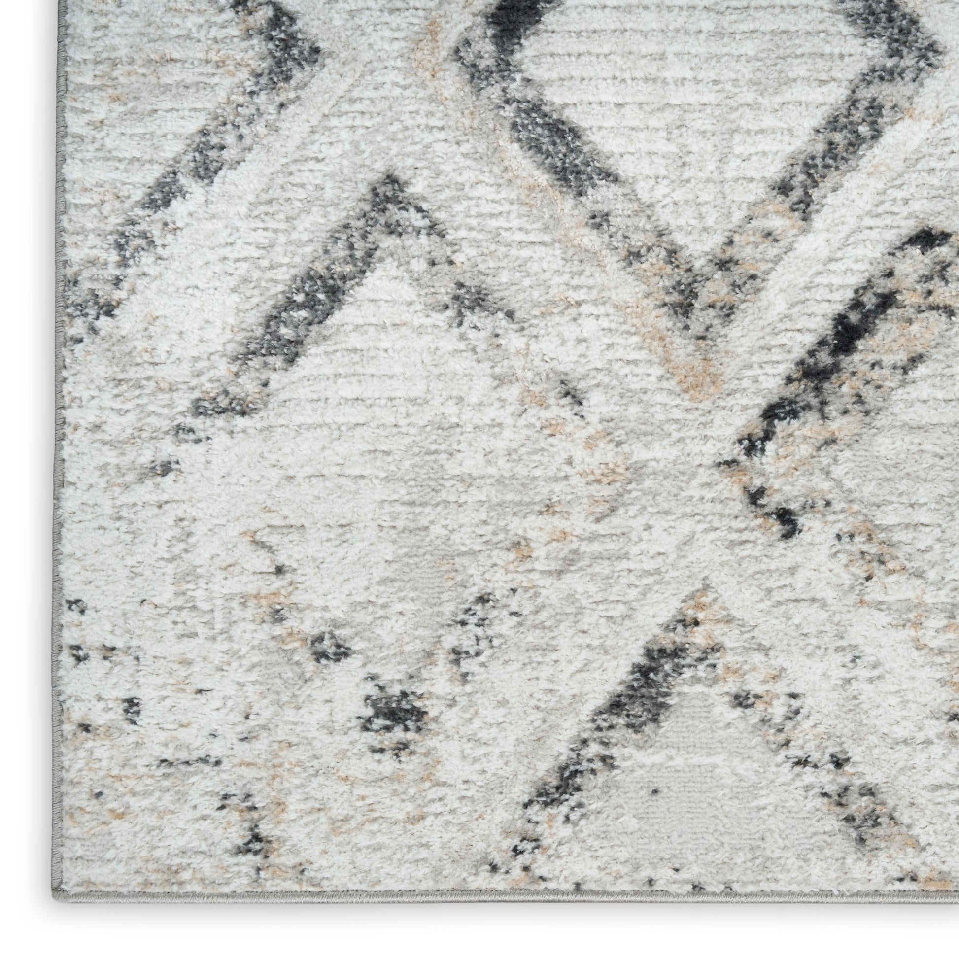 Cream and light gray shag rug with dark gray and beige diamond lattice pattern; plush, textured pile