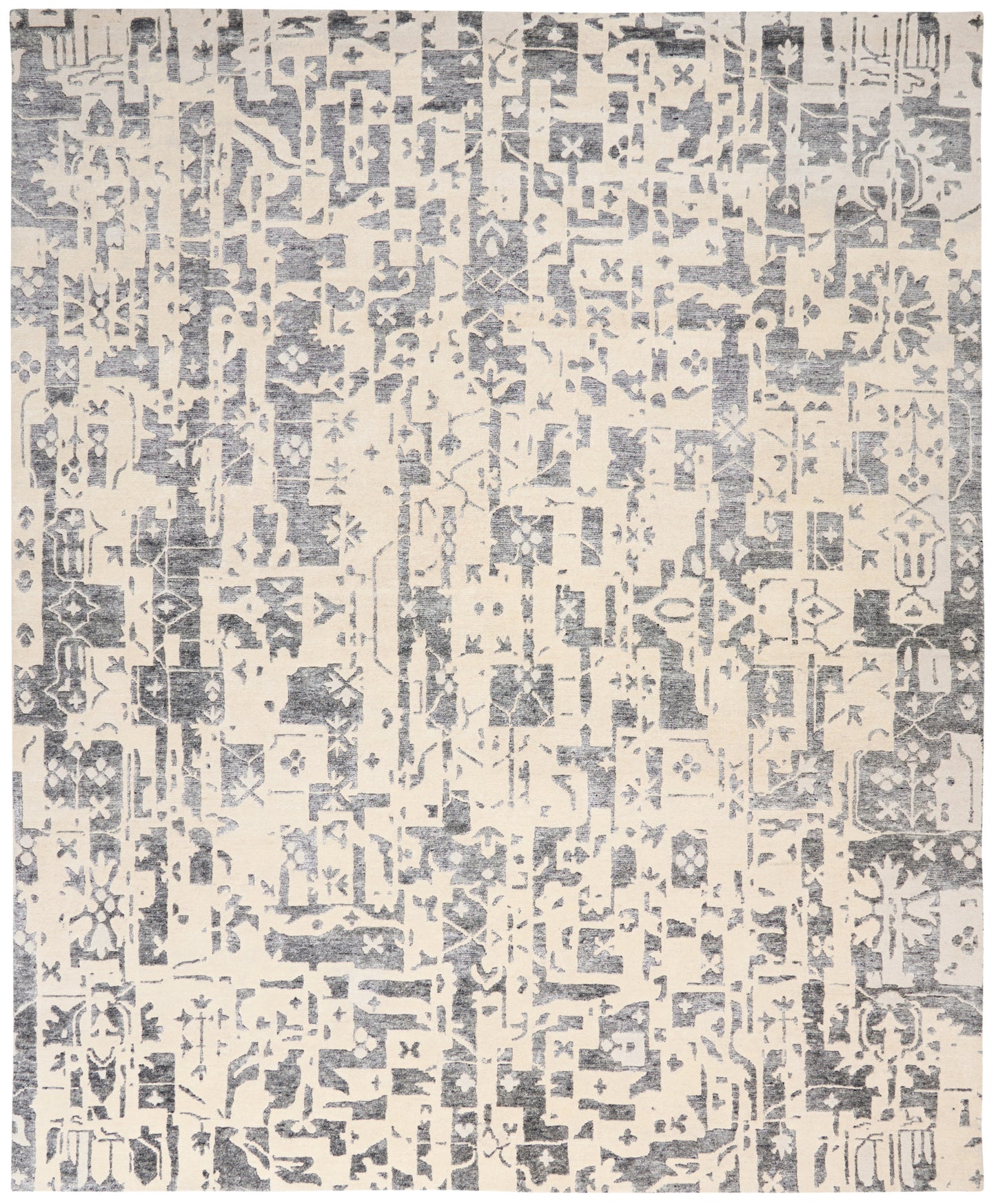 Cream-beige rug with blue-gray distressed geometric pattern; modern tribal style for living room floor.