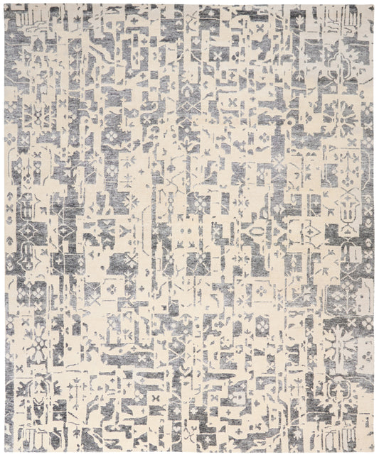 Cream-beige rug with blue-gray distressed geometric pattern; modern tribal style for living room floor.