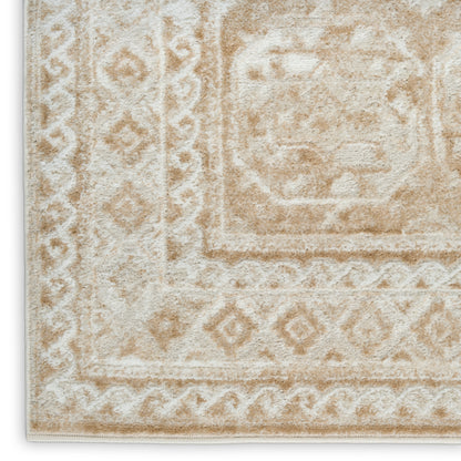 Cream-beige oriental rug with diamond border patterns and central medallion, plush textured pile.