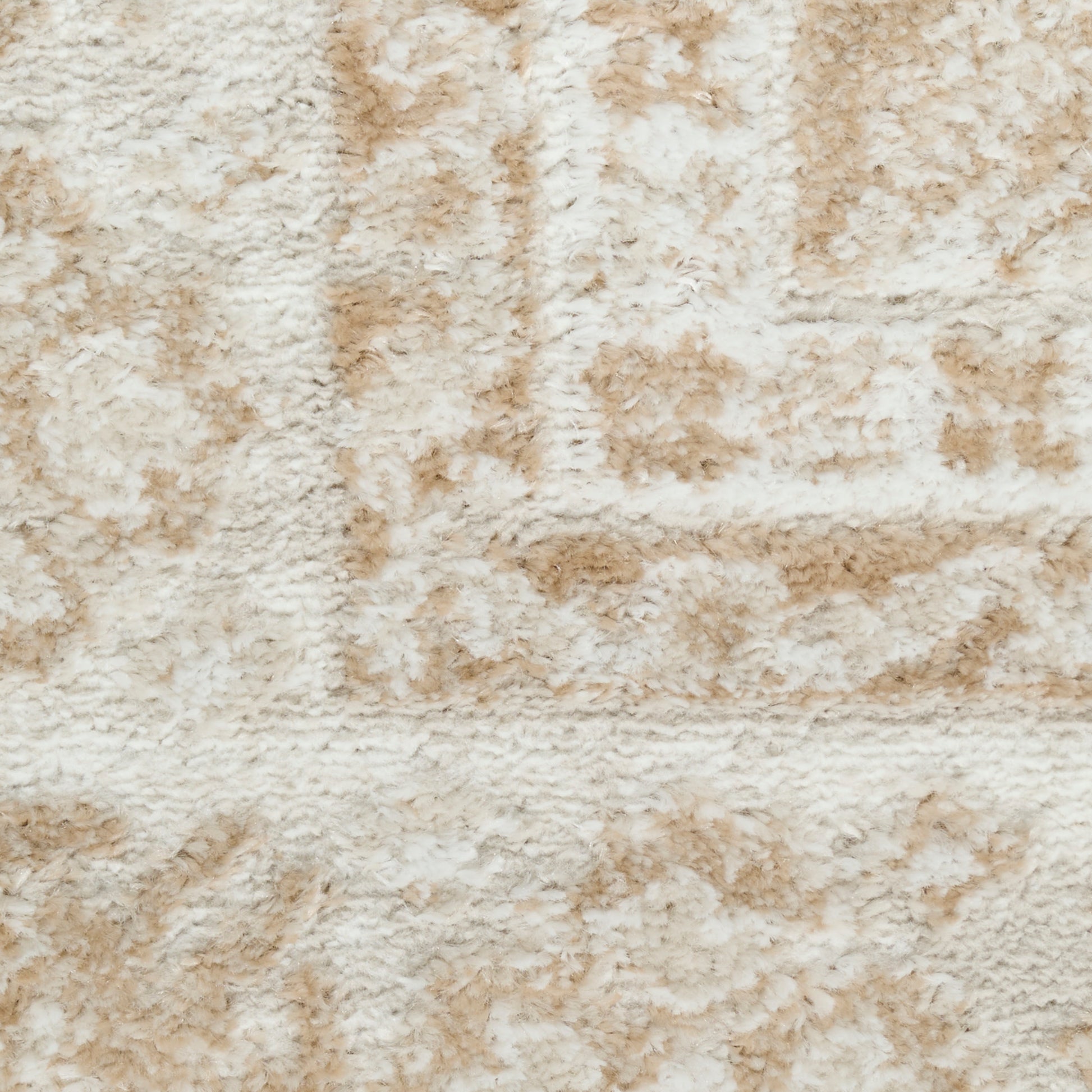 Beige cream shag rug texture with soft pile and subtle tan geometric rectangular pattern.