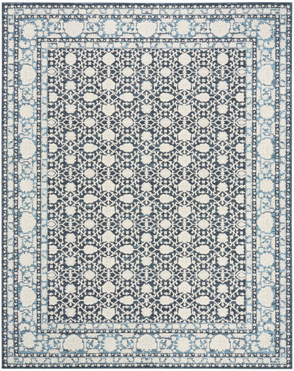 Rectangular area rug with navy field and ivory floral lattice, bordered by light blue borders in a Persian-inspired pattern.