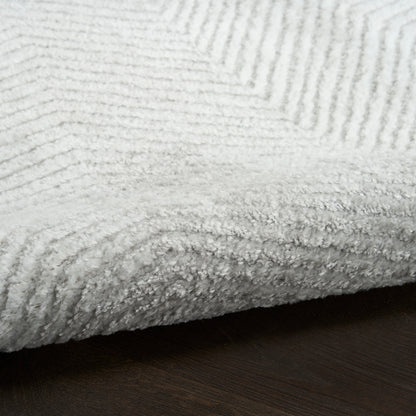 Soft plush rug with ribbed texture and thick edge.