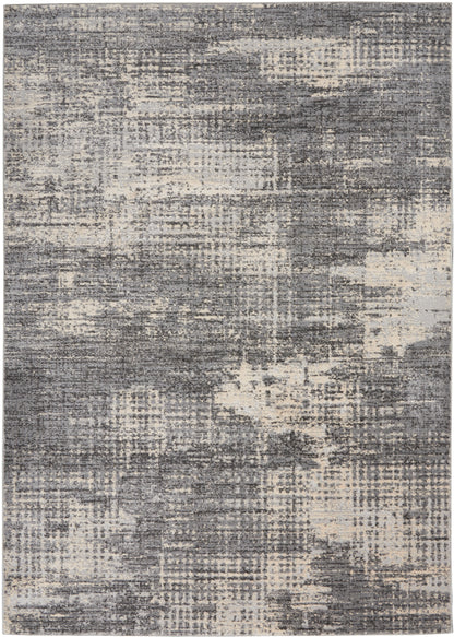 Rectangular area rug with a distressed gray and ivory abstract pattern; soft pile, modern chic.