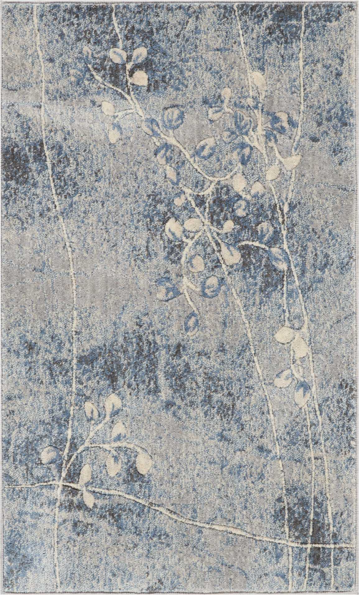 Rectangular blue-gray distressed rug with cream botanical vine and leaves, modern vintage style.