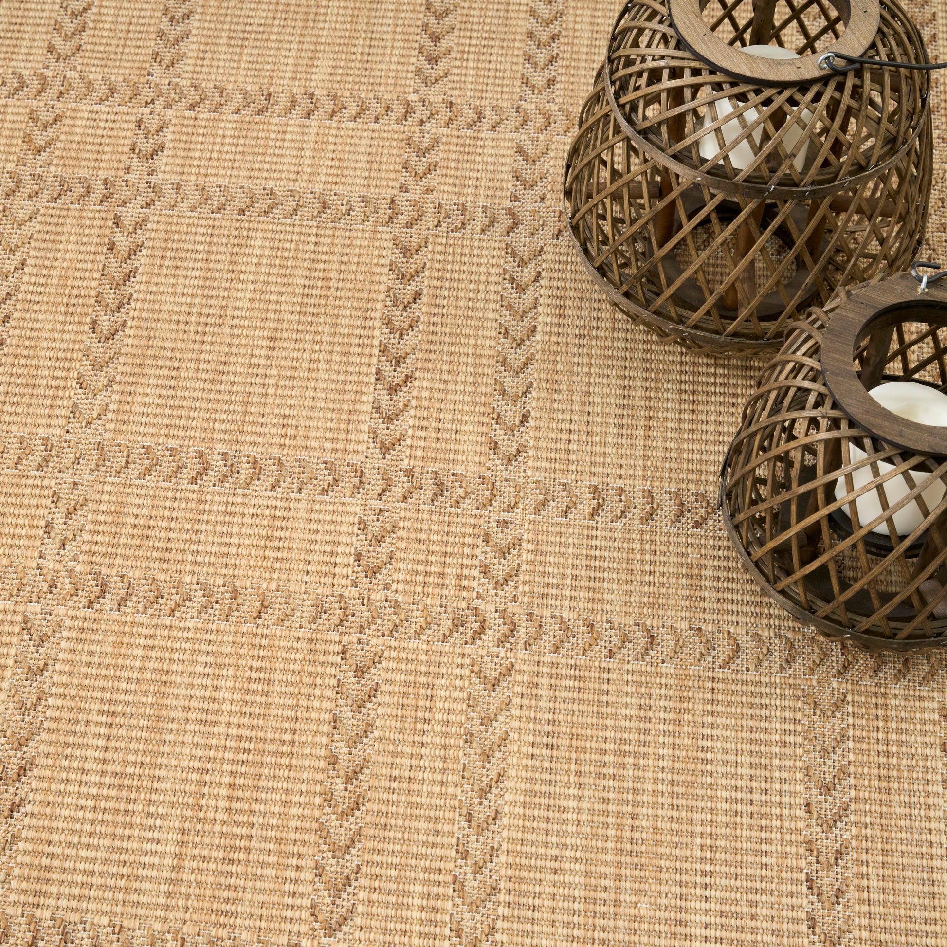 Beige woven jute rug with subtle geometric grid pattern.