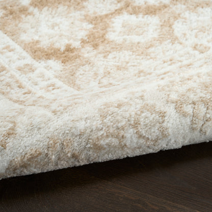 Beige & ivory shag rug with a subtle geometric pattern and plush pile on dark wood floor.