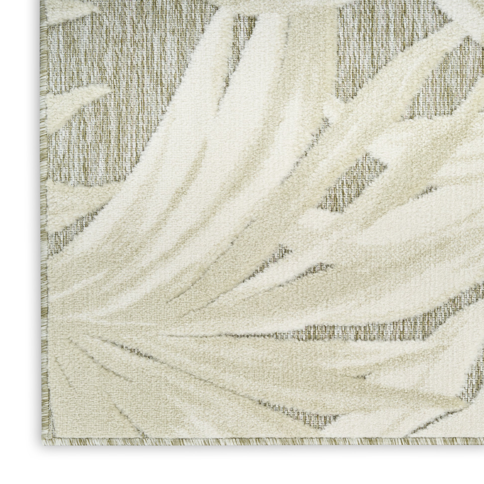 Ivory tufted rug with cream palm-leaf motif, soft textured pile and light beige border.