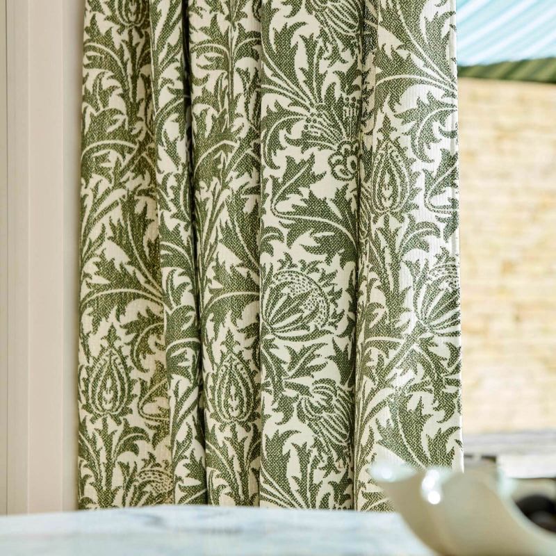 Morris & Co Thistle Weave fabric in Nettle featuring a classic botanical thistle pattern with woven texture, designer upholstery fabric suitable for cushions, curtains, blinds, occasional upholstery and general upholstery for indoor or outdoor décor projects.