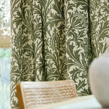 Morris & Co Thistle Weave fabric in Nettle featuring a classic botanical thistle pattern with woven texture, designer upholstery fabric suitable for cushions, curtains, blinds, occasional upholstery and general upholstery for indoor or outdoor décor projects.