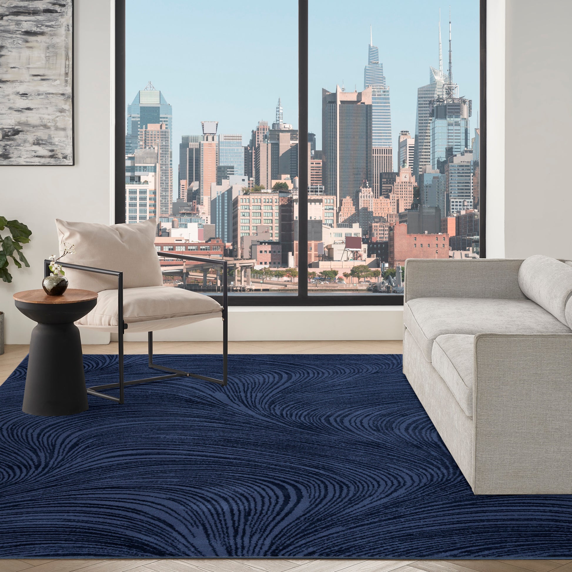 8’ x 10’ navy abstract Central Park West area rug with modern swirl design, indoor contemporary rug ideal for living room, bedroom, and stylish home decor.