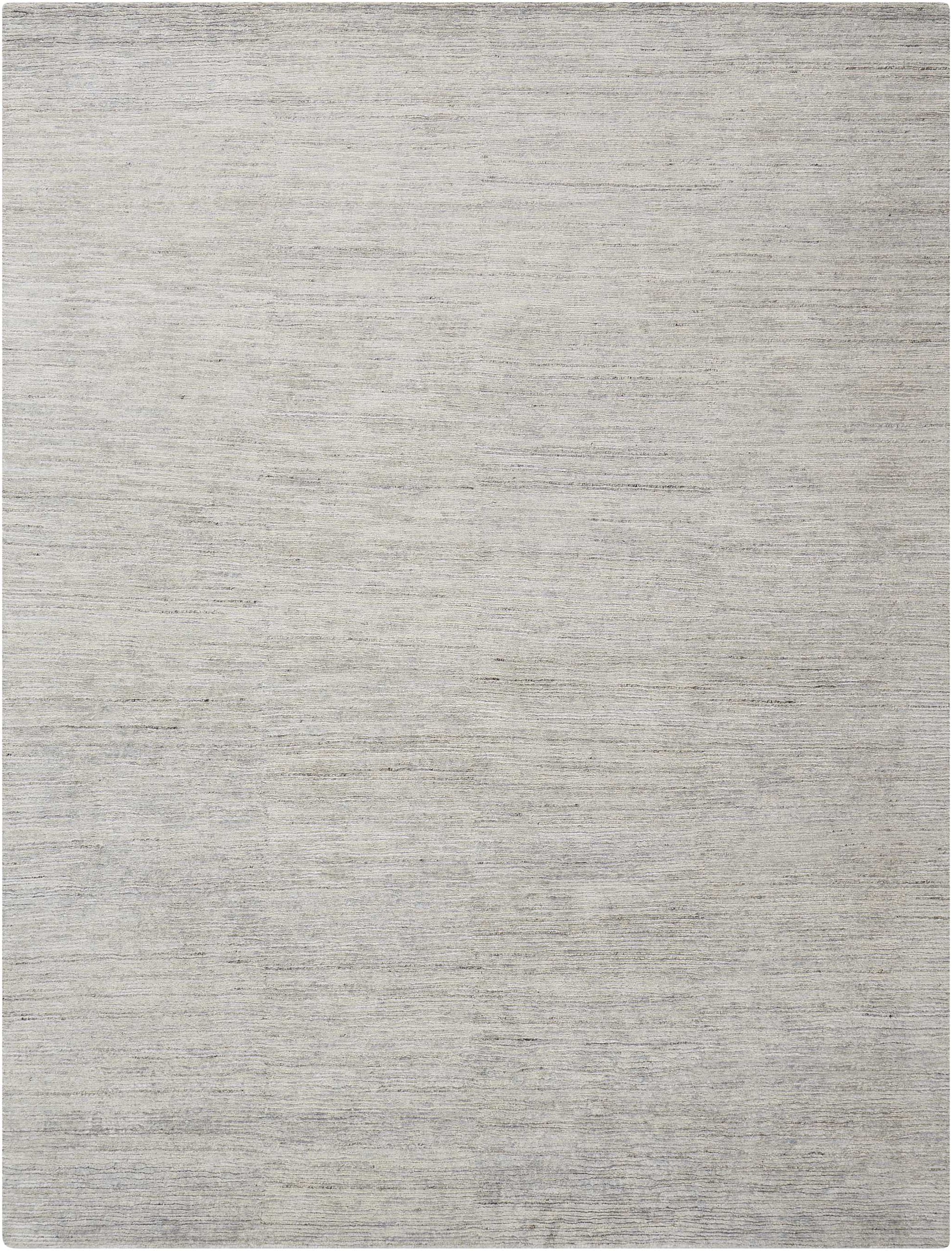 Neutral gray flat-weave rug with soft texture and tonal variation, rectangular for living rooms.