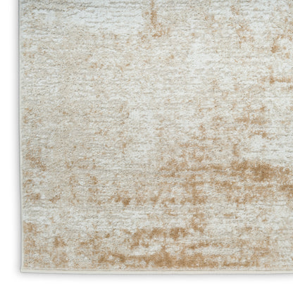 Beige and ivory abstract textured area rug with a soft plush pile and a subtle mottled pattern.