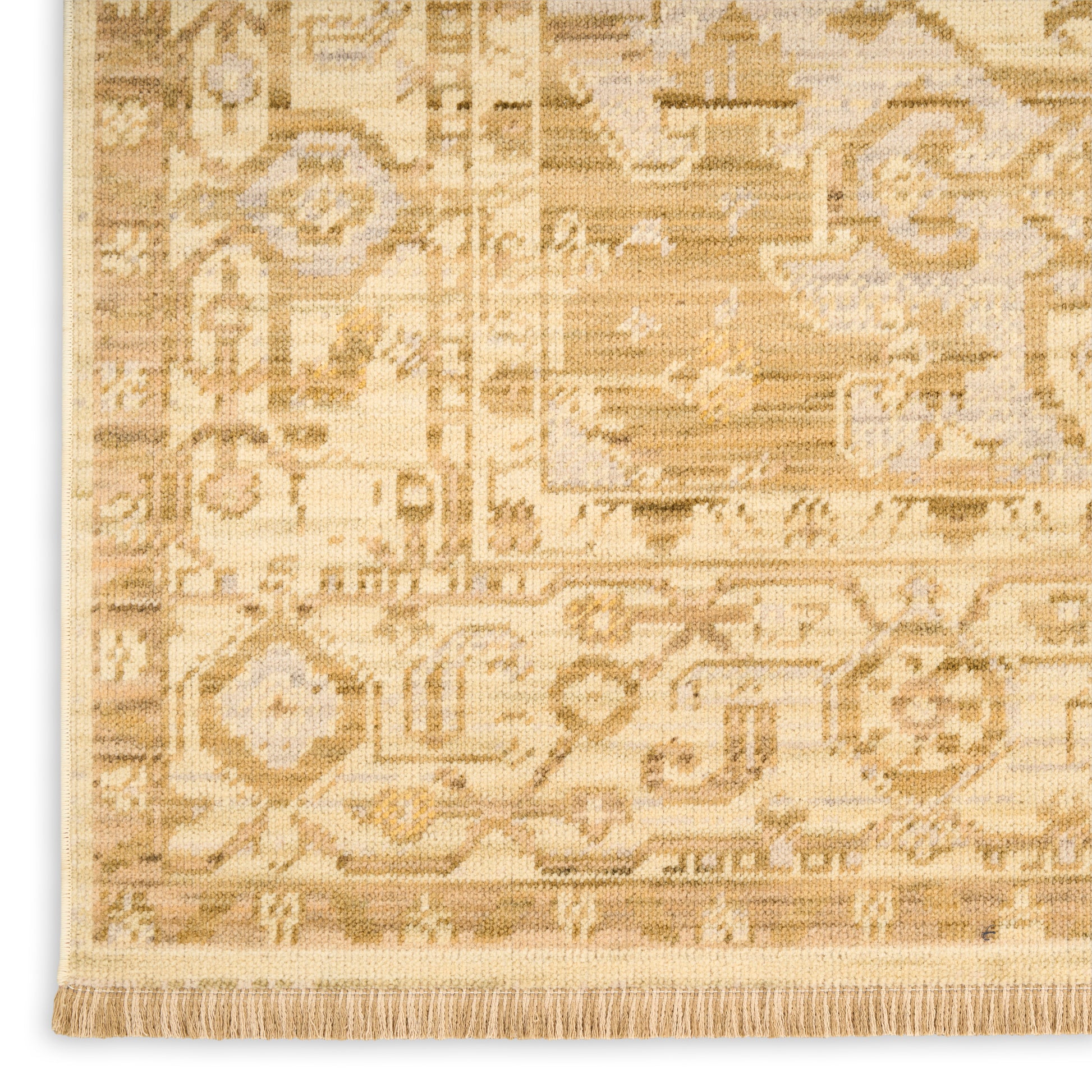 Beige oriental rug with intricate geometric patterns in cream and tan, fringed edge.