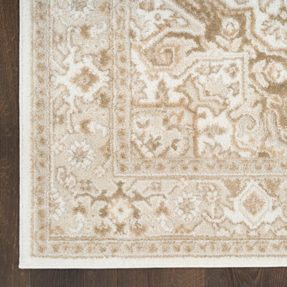 Beige ivory vintage traditional area rug with ornate floral border and medallion pattern, 5' x 7', on dark wood floor