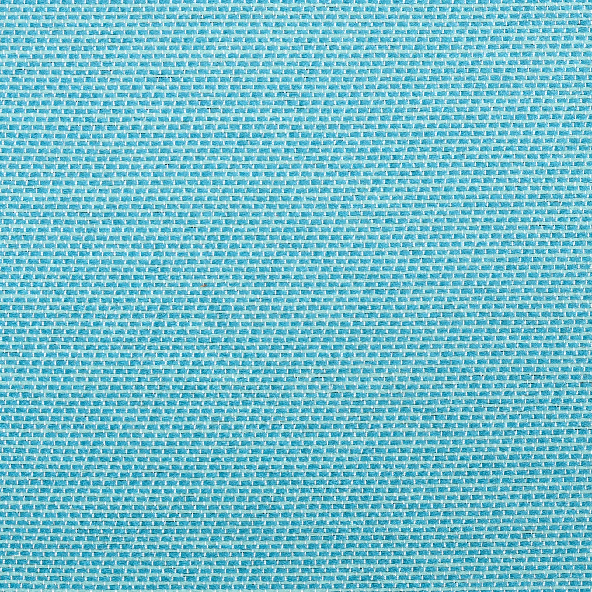 Close-up of bright blue rug with visible white threads in a grid texture.