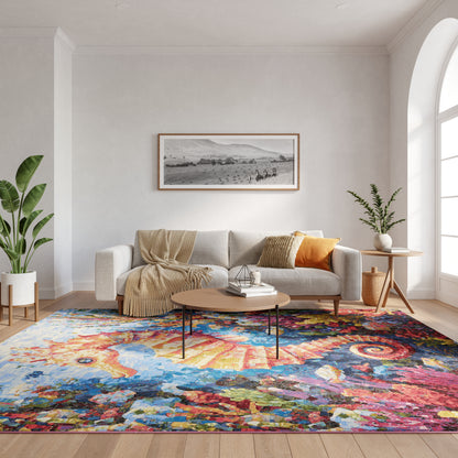 Bright living room with beige sofa, throw, orange cushion, coffee table, colorful rug, plants, arched window.