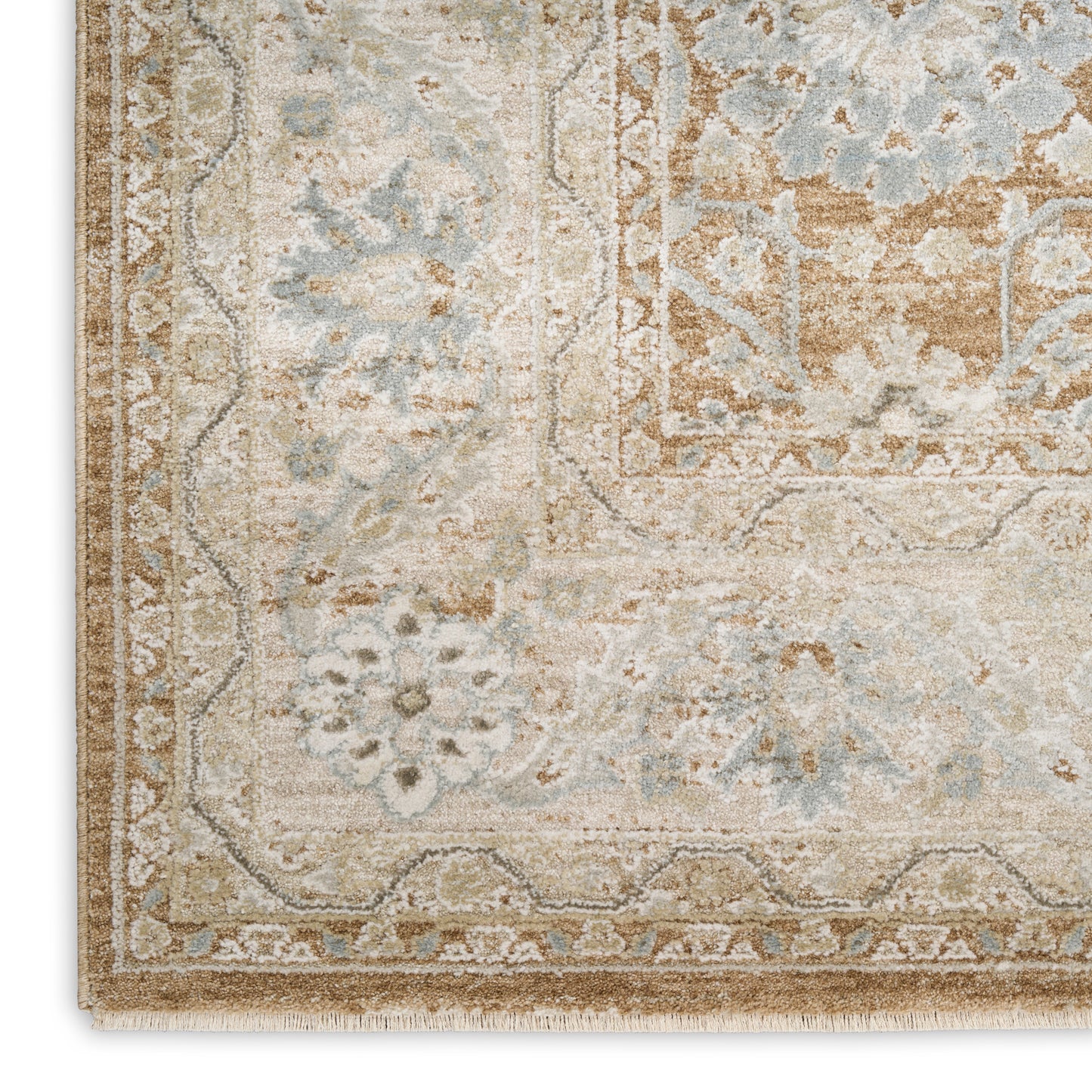 Muted beige and pale blue oriental rug with floral border and fringed edges