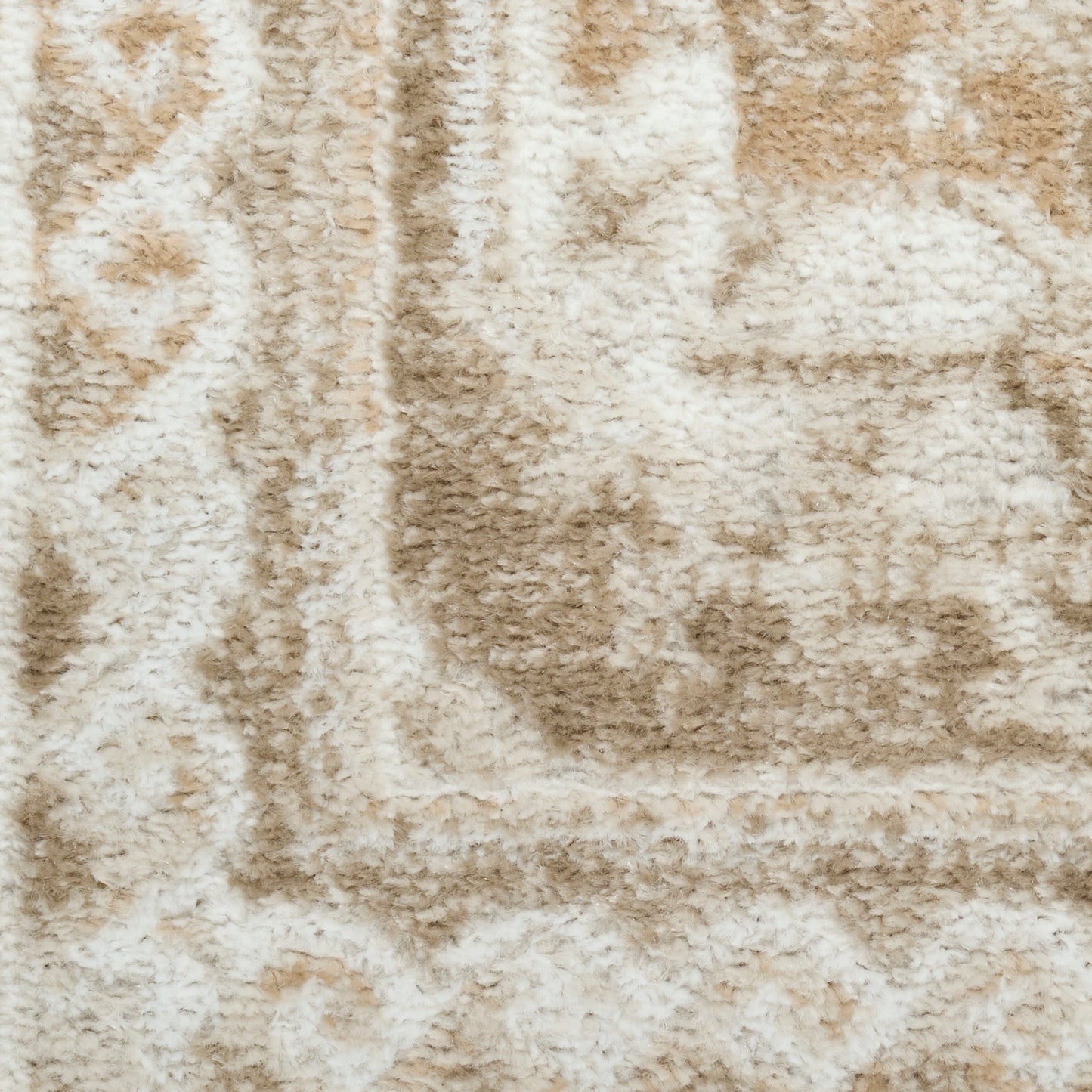 Beige and ivory shag rug with plush pile and subtle geometric border pattern.